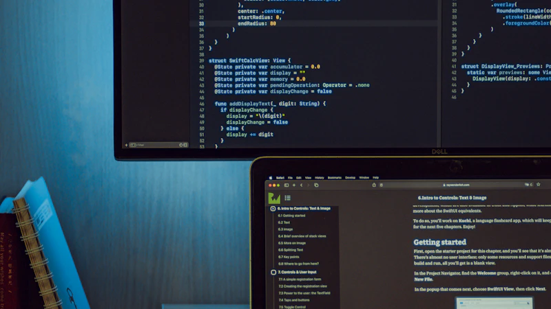 Monitor and laptop displaying Swift code