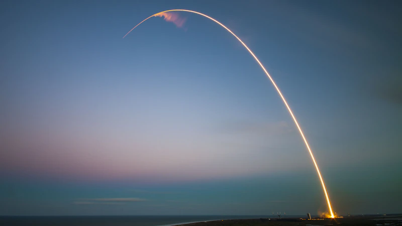 Rocket launch light trail at dusk
